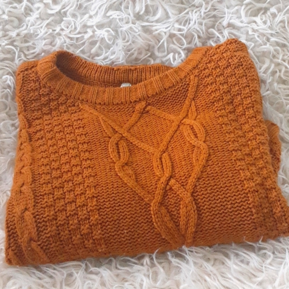 This sweater is a lovely mustard Orange.The sweater is from Mudd.